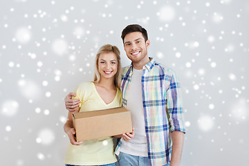 Image showing happy smiling couple with parcel box