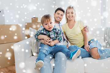 Image showing happy family with boxes moving to new home