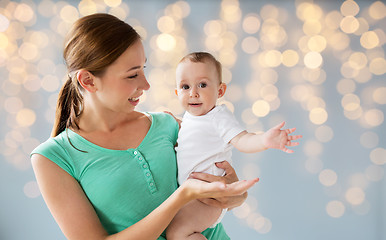 Image showing happy young mother with little baby