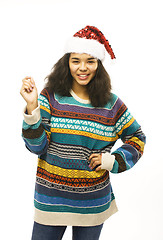 Image showing cute young real african hipster girl in santas red hat isolated 