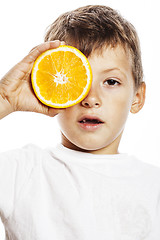 Image showing little cute boy with orange fruit double isolated on white smili