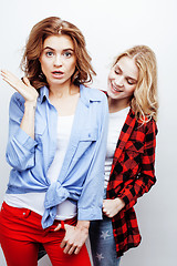 Image showing two pretty blond woman having fun together on white background, mature mother and young teenage daughter, lifestyle people concept