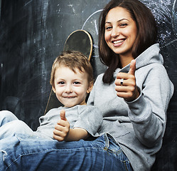 Image showing young hipster teenage girl sitting with her brother in classroom multinational, lifestyle people concept