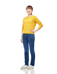 Image showing happy asian young woman over white