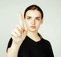 Image showing young pretty girl pointing on white background, business science concept