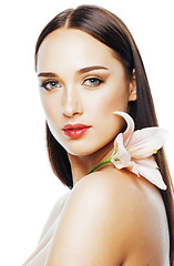 Image showing young attractive lady close up with hands on face isolated flowe