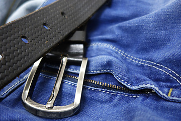 Image showing Blue jeans with black leather belt 