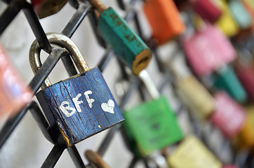 Image showing Best friend forever padlocks locked on iron chain