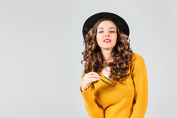 Image showing The girl in glasses and hat