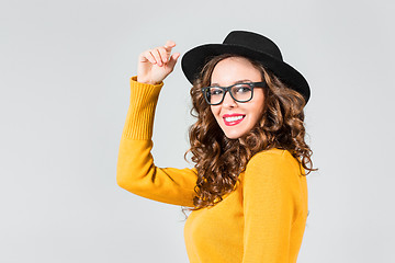 Image showing The girl in glasses and hat