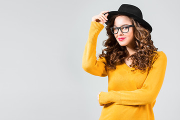 Image showing The girl in glasses and hat