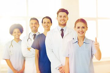 Image showing happy doctors showing thumbs up at hospital