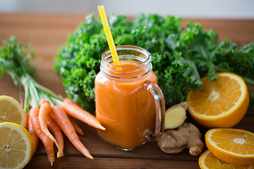 Image showing glass jug of carrot juice, fruits and vegetables