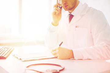 Image showing male doctor with capsules