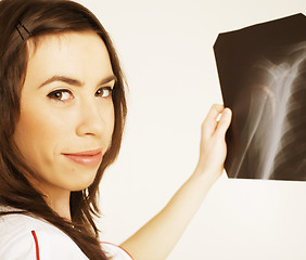 Image showing close up portrait of young doctor with x ray shot in hands