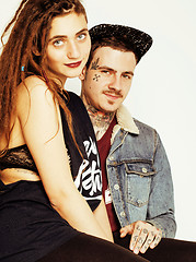 Image showing Young couple together making love, hugging. guy with tattoo, gir