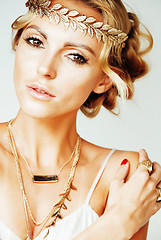 Image showing young blond woman dressed like ancient greek godess, gold jewelry close up isolated