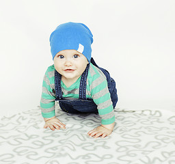 Image showing little cute baby toddler on carpet isolated close up smiling adorable