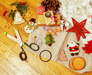 Image showing lot of stuff for handmade gifts, scissors, ribbon, paper with co