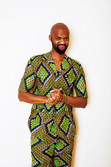 Image showing portrait of young handsome african man wearing bright green nati