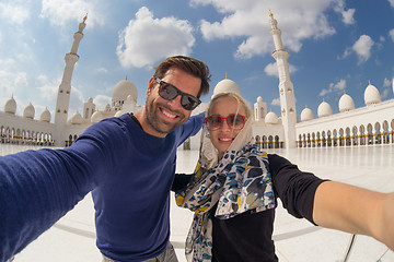 Image showing Couple taking selfie in Sheikh Zayed Grand Mosque, Abu Dhabi, United Arab Emirates.