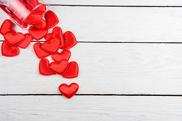 Image showing Red hearts on a white wood background
