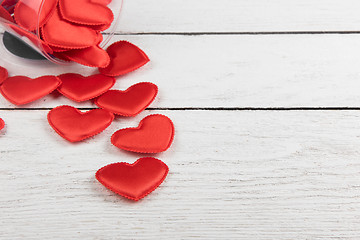 Image showing Red hearts on a white wood background