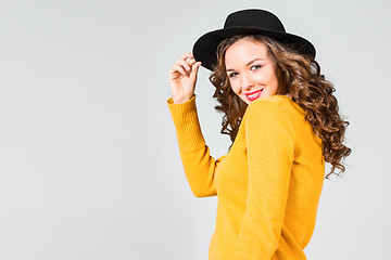 Image showing The smiling girl and hat