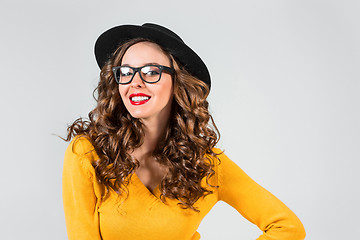 Image showing The girl in glasses and hat