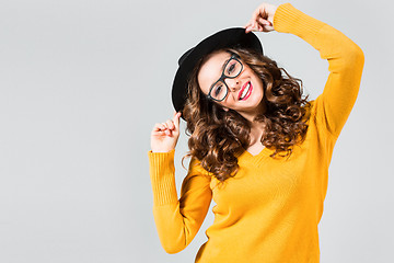 Image showing The girl in glasses and hat