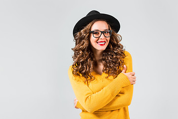 Image showing The girl in glasses and hat