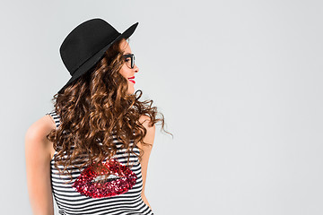 Image showing The girl in glasses and hat