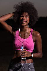 Image showing african american woman jogging in nature