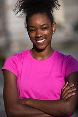 Image showing Portrait of sporty young african american woman running outdoors