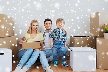 Image showing happy family with boxes moving to new home