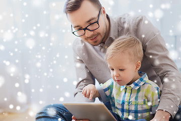 Image showing father and son with tablet pc playing at home