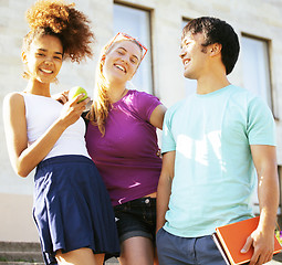 Image showing cute group teenages at the building of university with books huggings