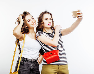 Image showing two best friends teenage girls together having fun, posing emotional on white background, besties happy smiling, making selfie, lifestyle people concept