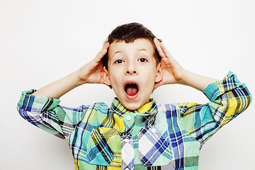 Image showing young pretty little boy kid wondering, posing emotional face isolated on white background, gesture happy smiling close up, lifestyle people concept