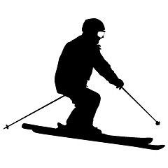 Image showing Mountain skier speeding down slope. sport silhouette