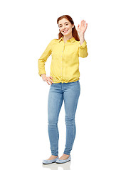 Image showing happy smiling woman waving hand over white