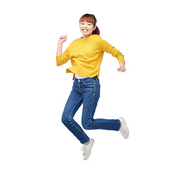 Image showing happy asian woman jumping over white