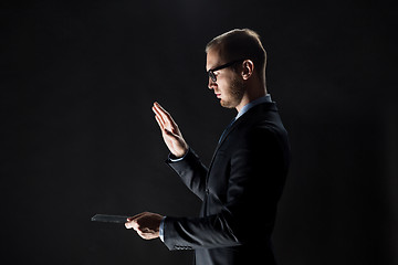 Image showing close up of businessman with transparent tablet pc