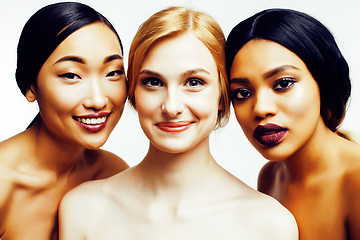 Image showing three different nation woman: asian, african-american, caucasian together isolated on white background happy smiling, diverse type on skin, lifestyle people concept