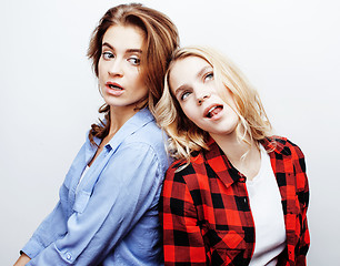 Image showing two pretty blond woman having fun together on white background, mature mother and young teenage daughter, lifestyle people concept