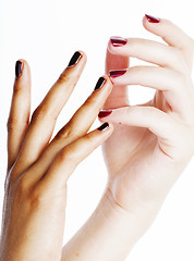 Image showing two different nathion manicured hands on white isolated, african