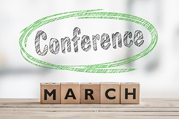 Image showing March conference with a wooden sign