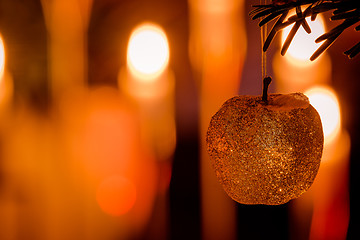 Image showing Glittering Xmas apple on a tree