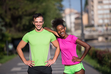 Image showing portrait of young multietnic jogging couple ready to run