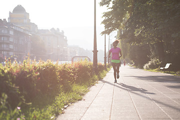 Image showing african american woman jogging in the city